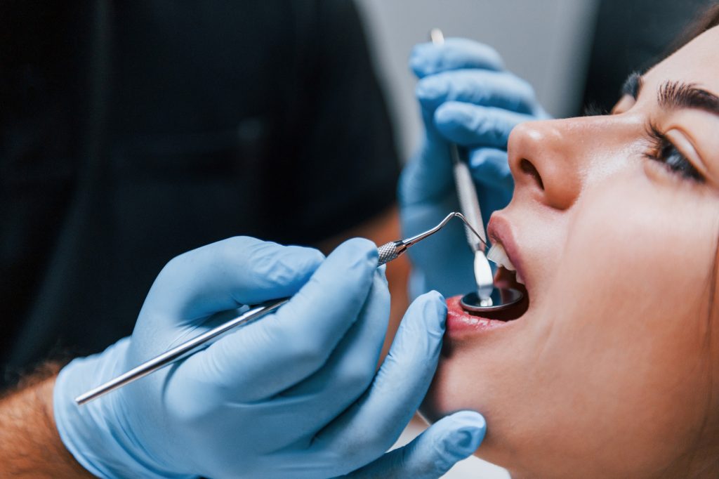 Patient receiving a dental checkup at Krusich Dental in Leawood, KS